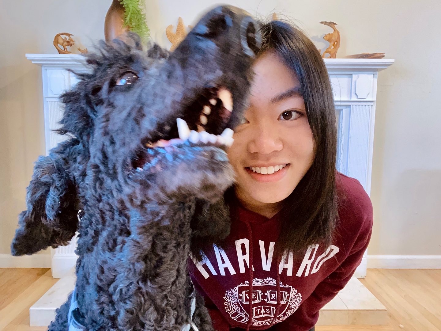Astro leaning into a photo together beside the fireplace