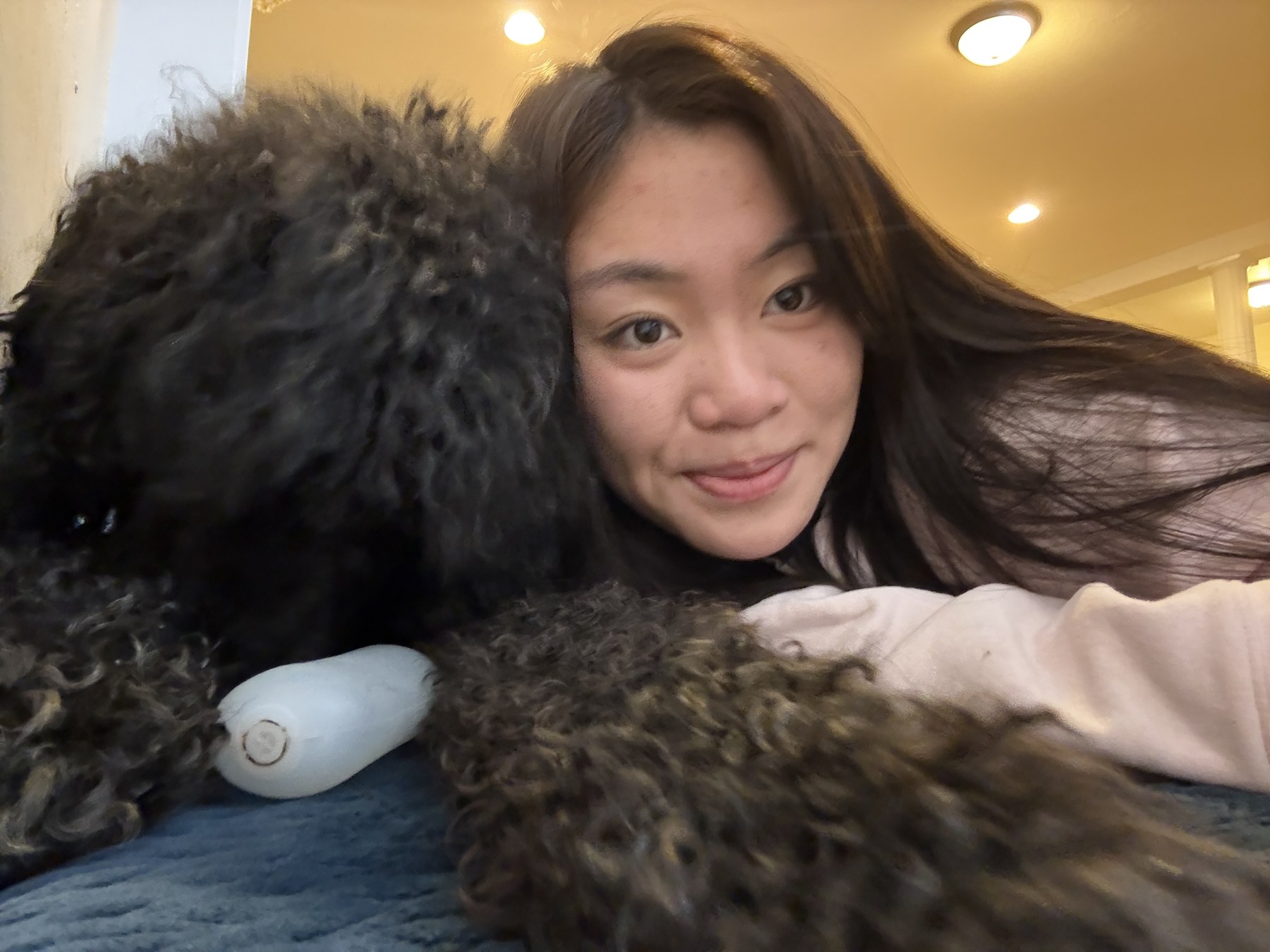 Astro cuddling in a close-up selfie